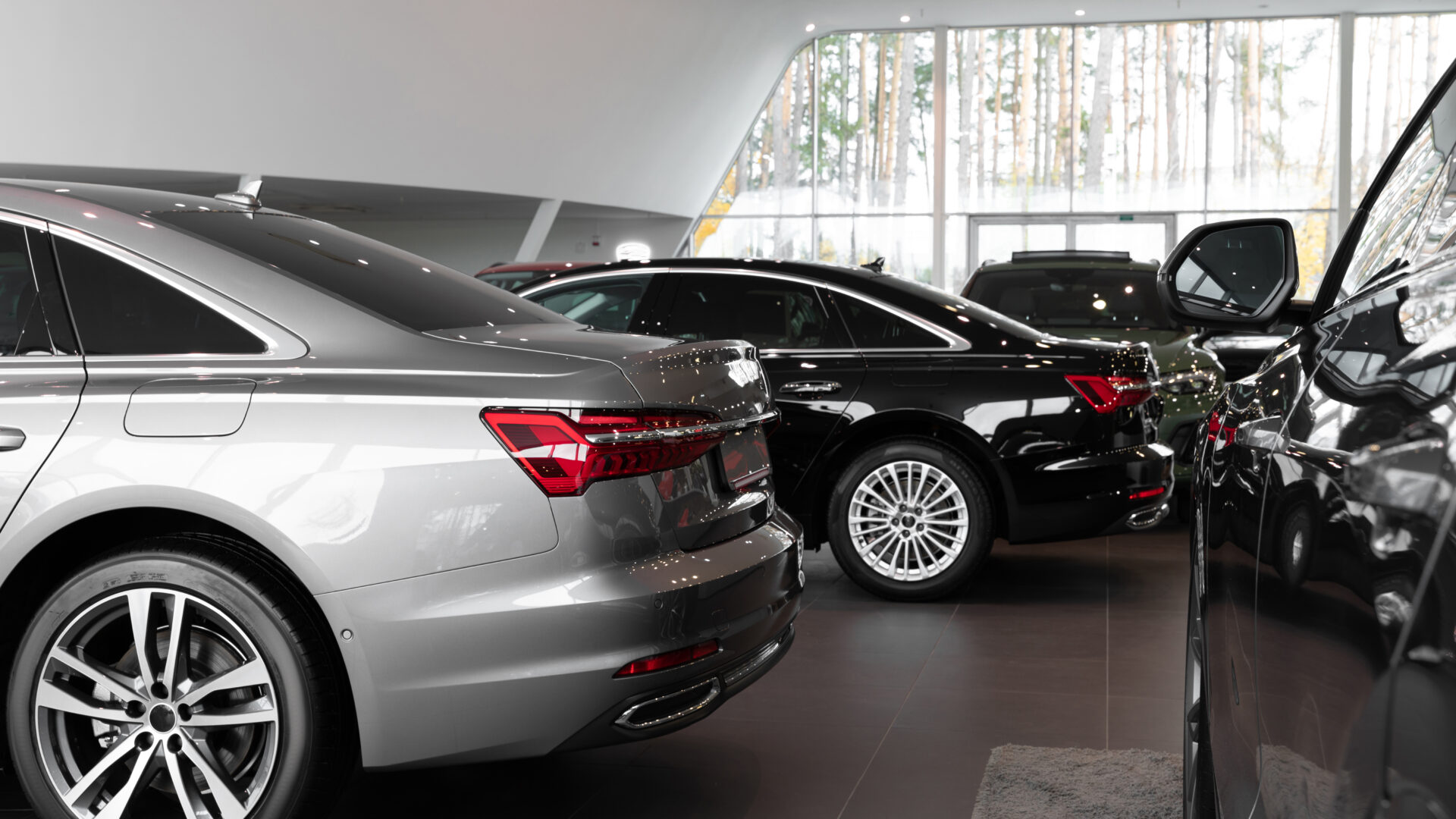 Cars in the showroom, luxury cars in the interior of a car dealership.