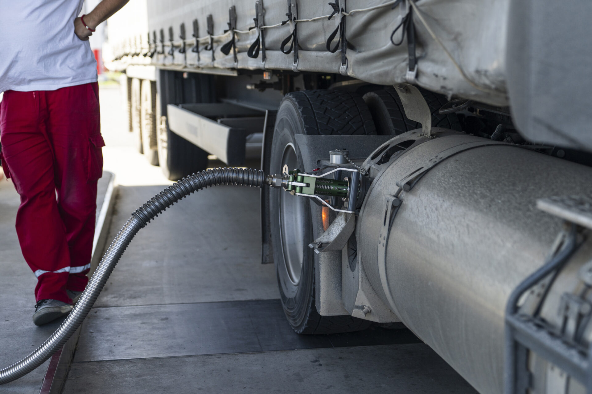 Semi truck refueling with tank for liquid natural gas (LNG).